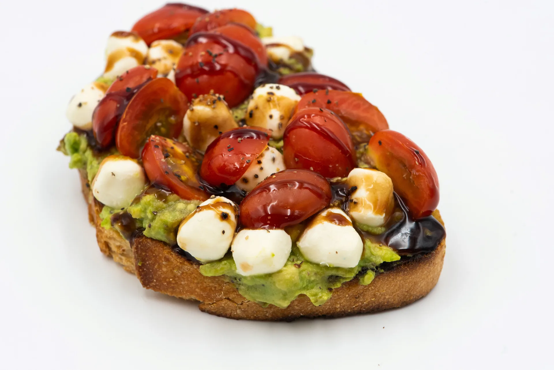 Tomatoes, Mozzarella, and avocado on toast.