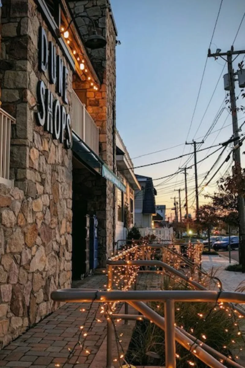 Dune Shops image with Christmas lights on the railing.