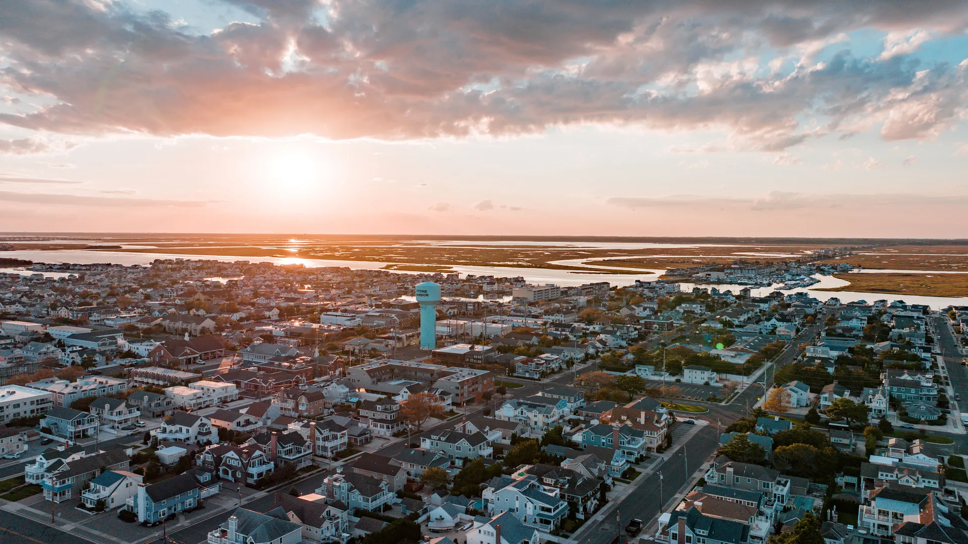 Drone photo of Stone Harbor, New Jersey with the sun setting.